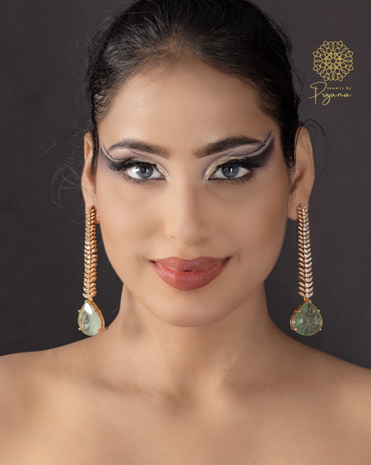 Tarishi Green Glow Dangler Earrings